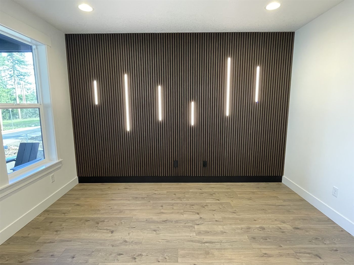Dark slat accent walls with LED