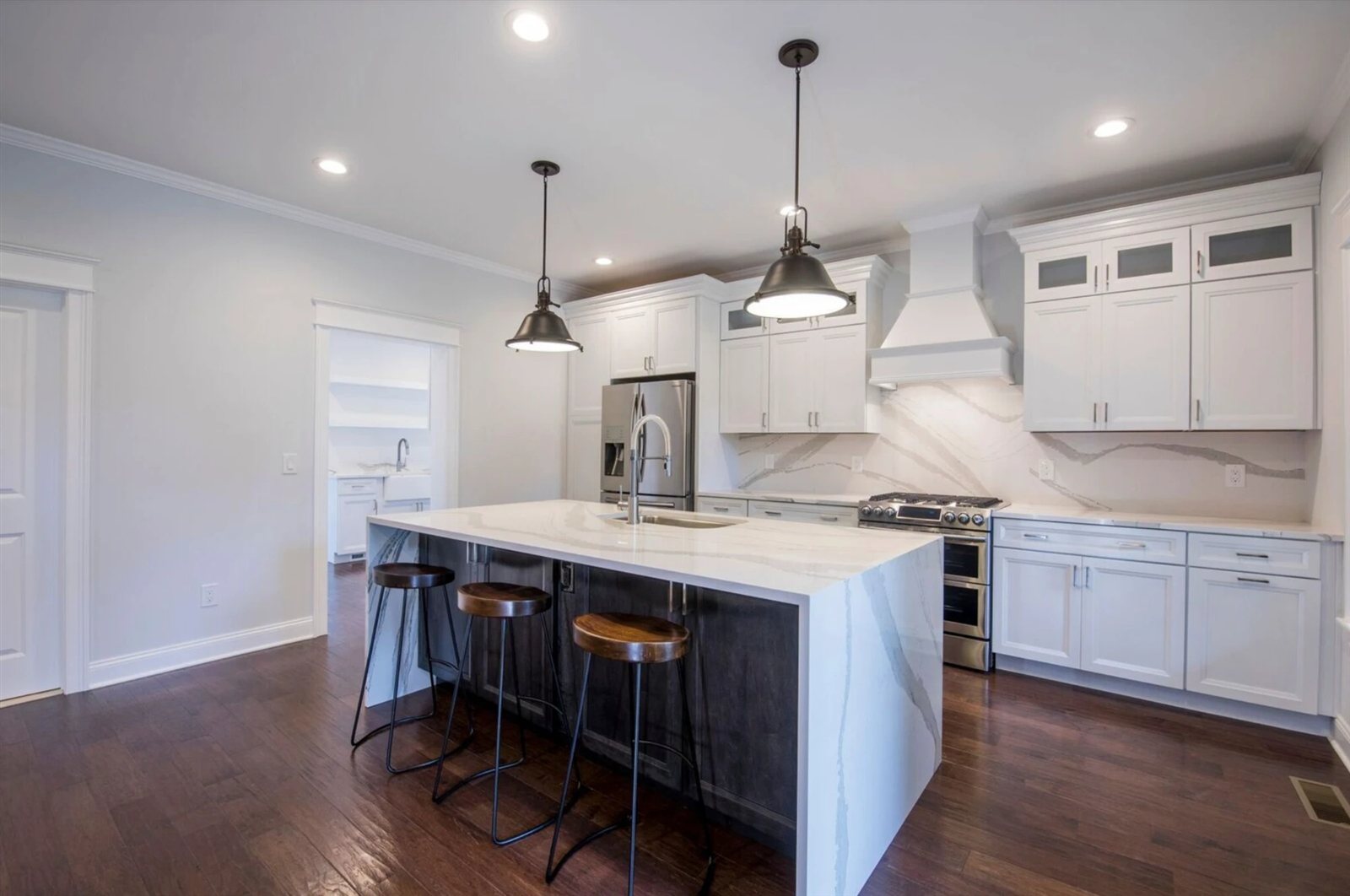 Kitchen with quartz waterfall island