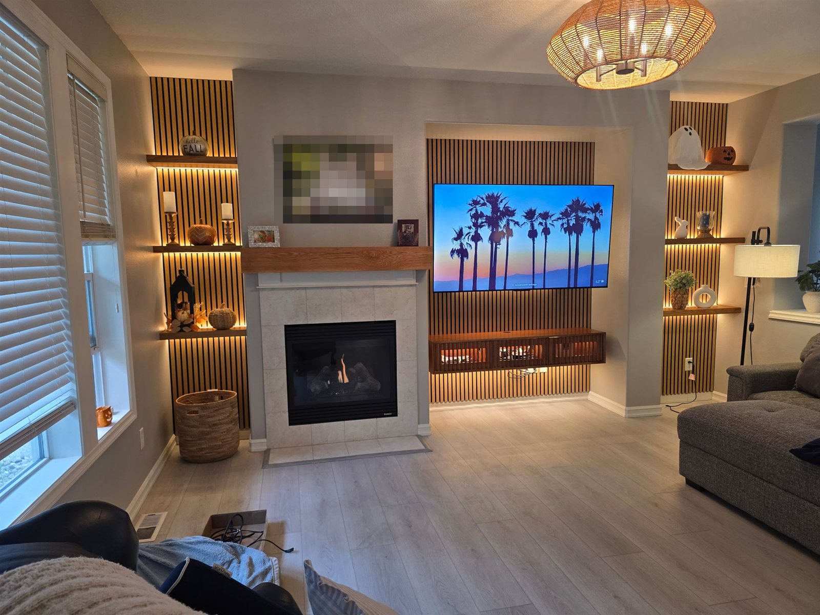 Media wall with slat console and lit shelves